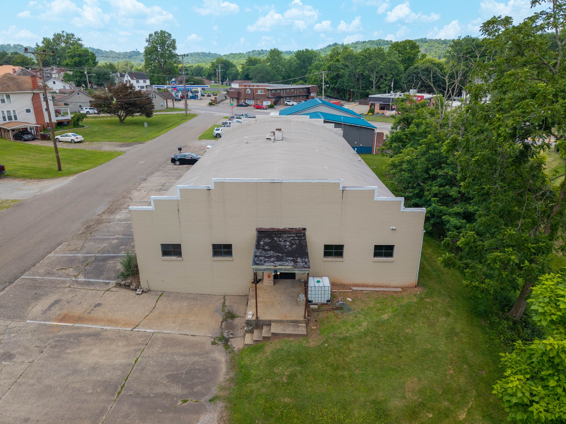 Ground-level photograph of a Main Street business storefront with professional lighting, clean facade, and welcoming entrance